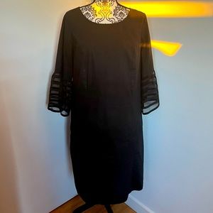 Eshakti light weight black dress with decorative sheer stripe sleeves.